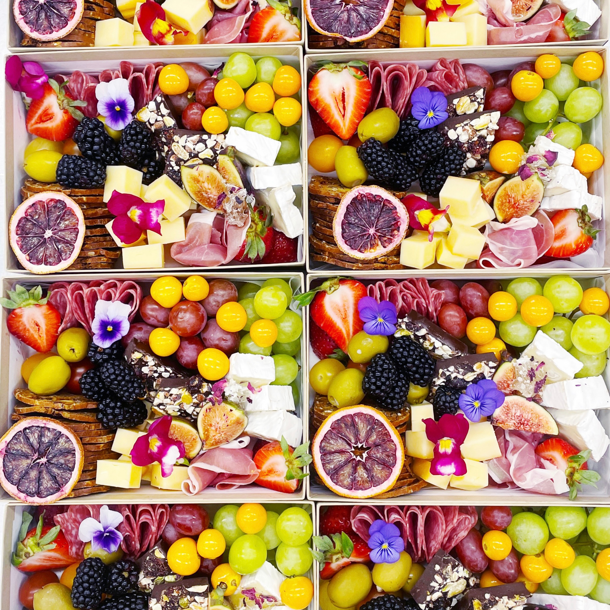 Individual Graze Box with Charcuterie, Cheeses, Fresh Fruits, Baguette, Edible Flowers. Regular, Gluten Free, Vegetarian, Dairy free and Gluten free available.